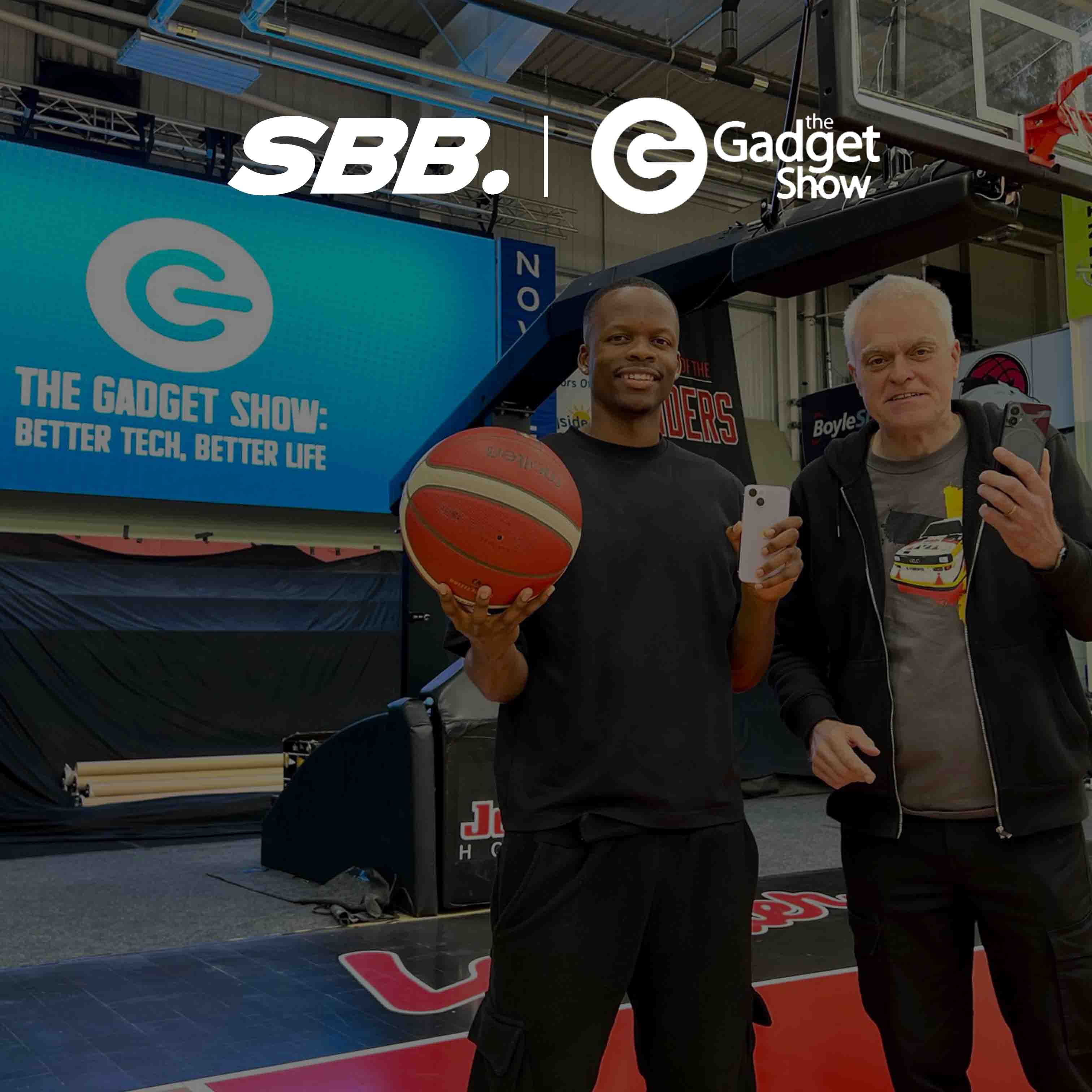 Denzel from Simply British Ballers. (SBB) stands with Jon Bentley the famous journalist & television presenter as they collaborated on an episode of the gadget show for channel 5.  